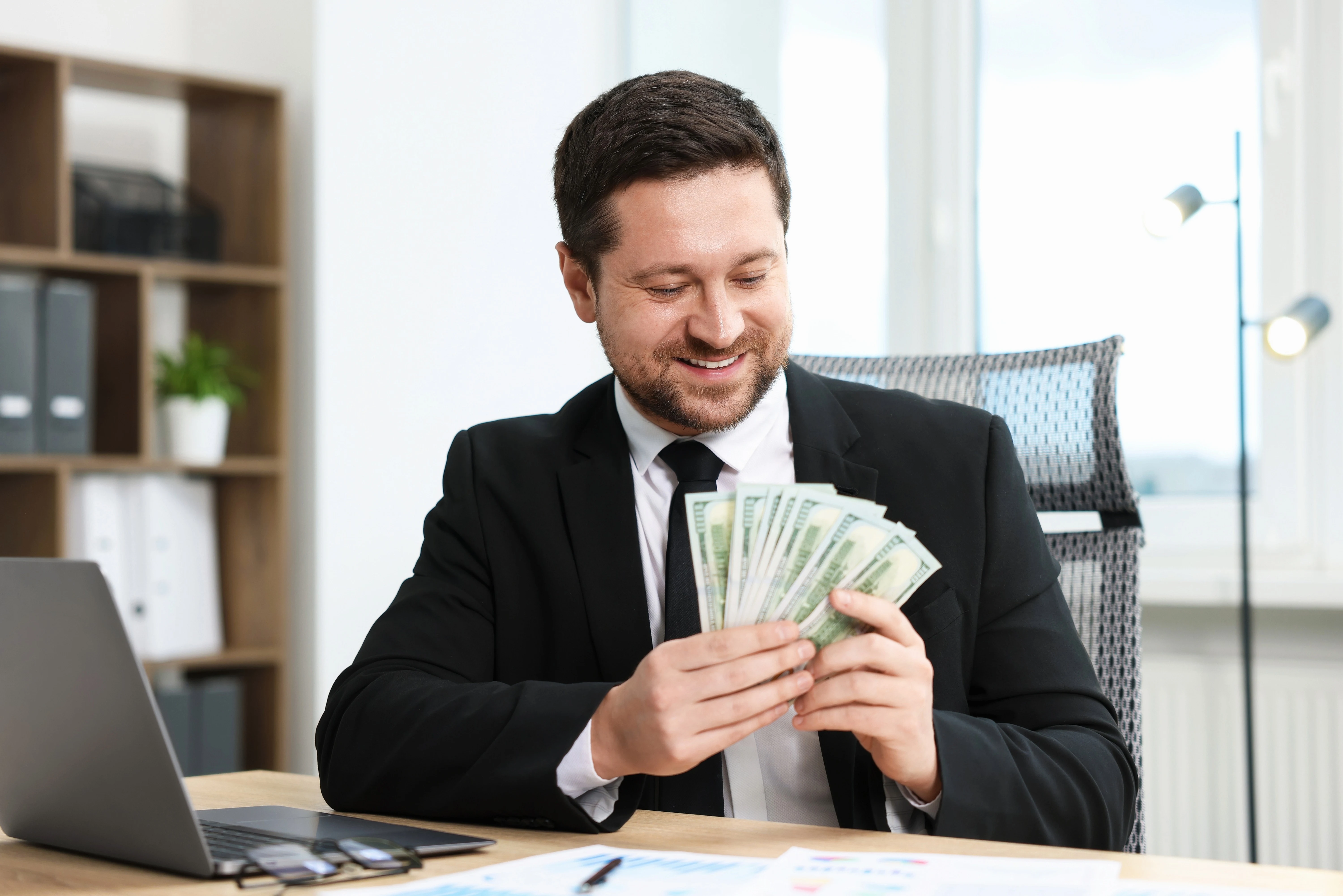 An illustration of a team collaborating in a professional office environment.